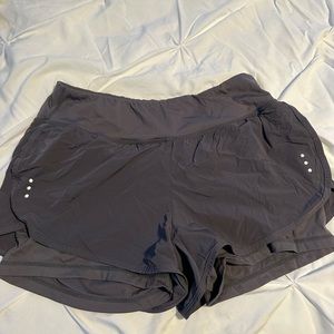Greyish black active shorts size L.
